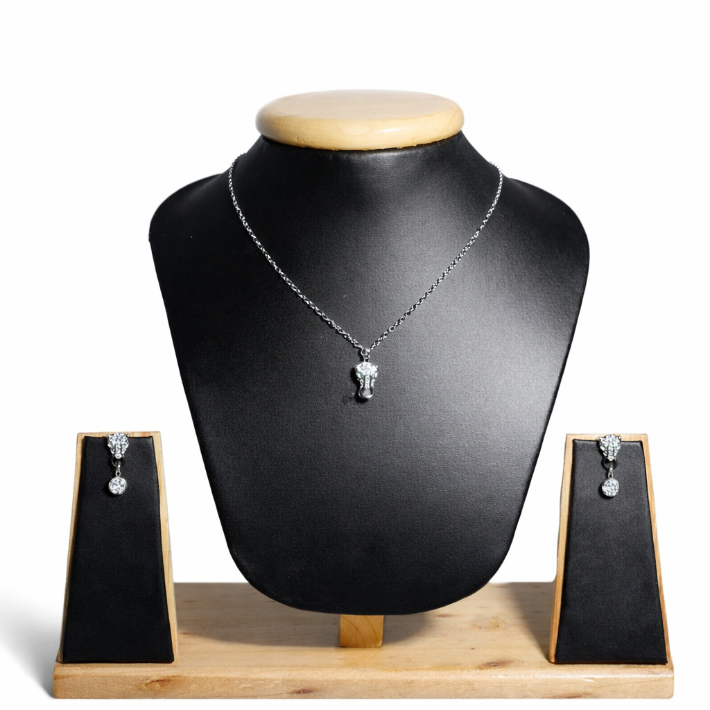 Elegant design &nbsp; A delicate silver chain with a brilliant round-cut diamond pendant, paired with matching diamond stud earrings for timeless sophistication.
