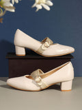 cream solid closed back block pumps
